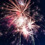 Fireworks going off in night sky by rovenimages