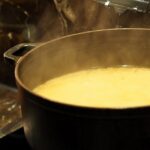 bone broth for dogs in soup pot by Eak K