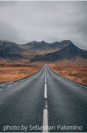 traveling down road in mountains
